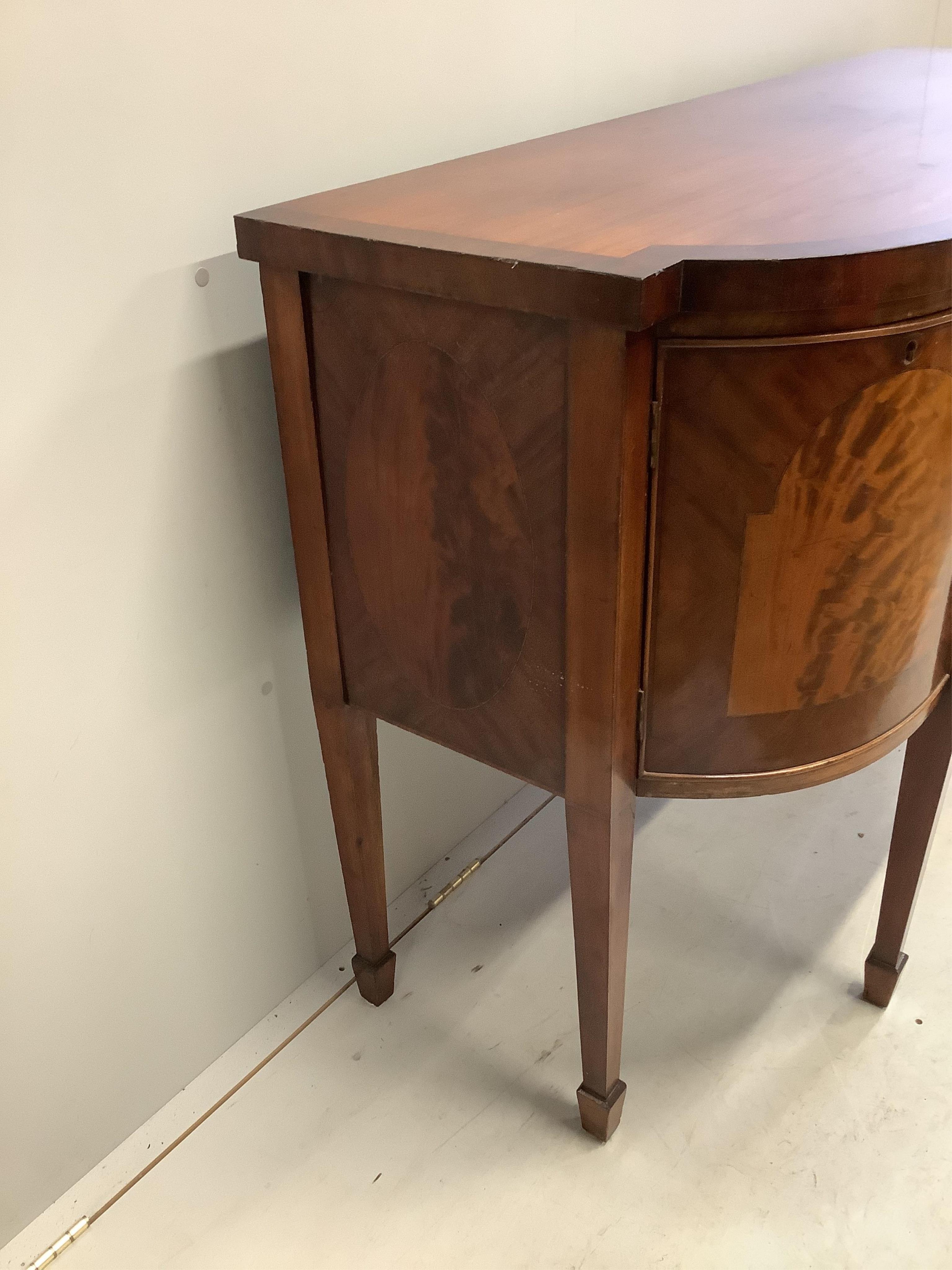 A George IV mahogany bow front sideboard, width 150cm, depth 57cm, height 95cm. Condition - poor to fair